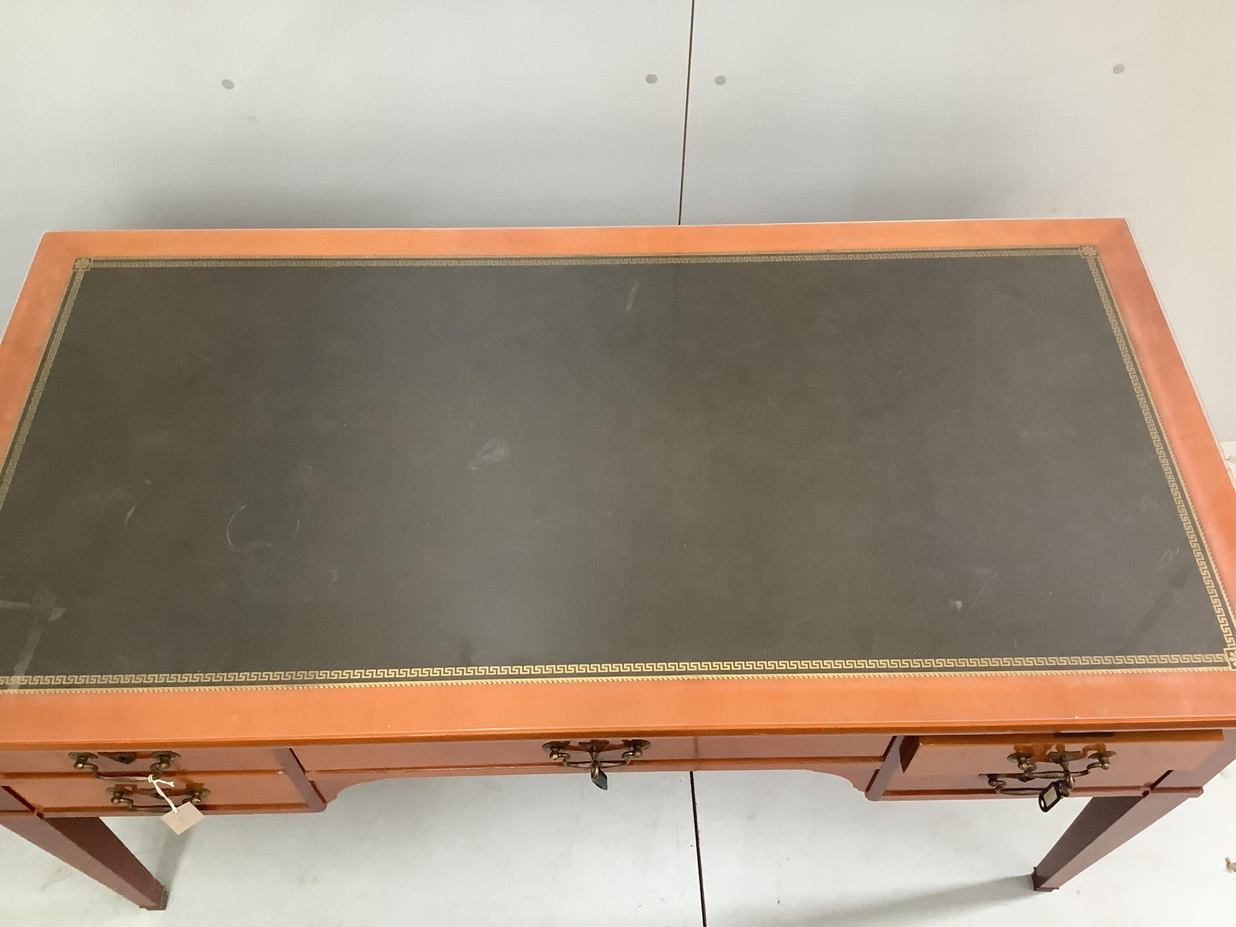 A reproduction cherry kneehole desk with green leather inset top, width 150cm, depth 74cm, height 76cm. Condition - good